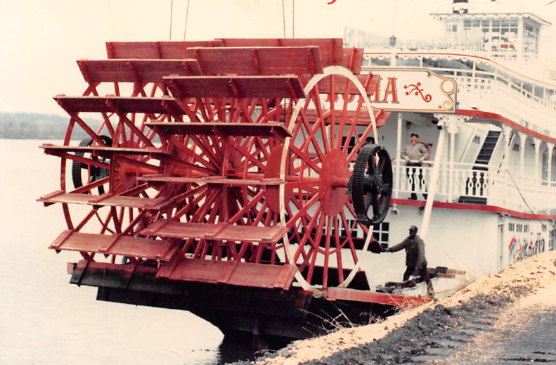 Riverboat with paddlewheel